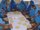 Rolling papads at the Community Centre at Village Bhitor, U.P